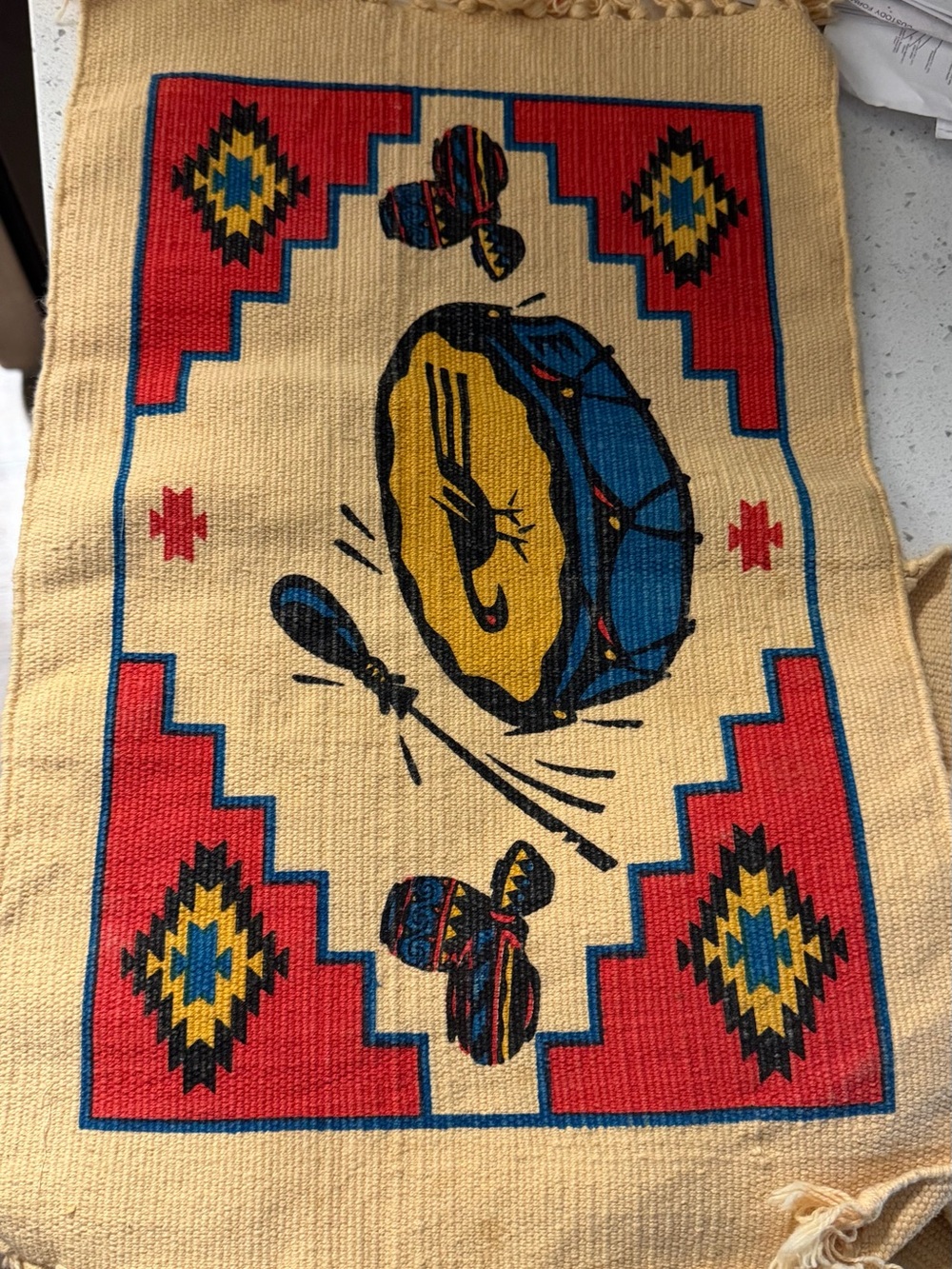 Handwoven Drum Motif Wall Tapestry in Red, Blue, Yellow